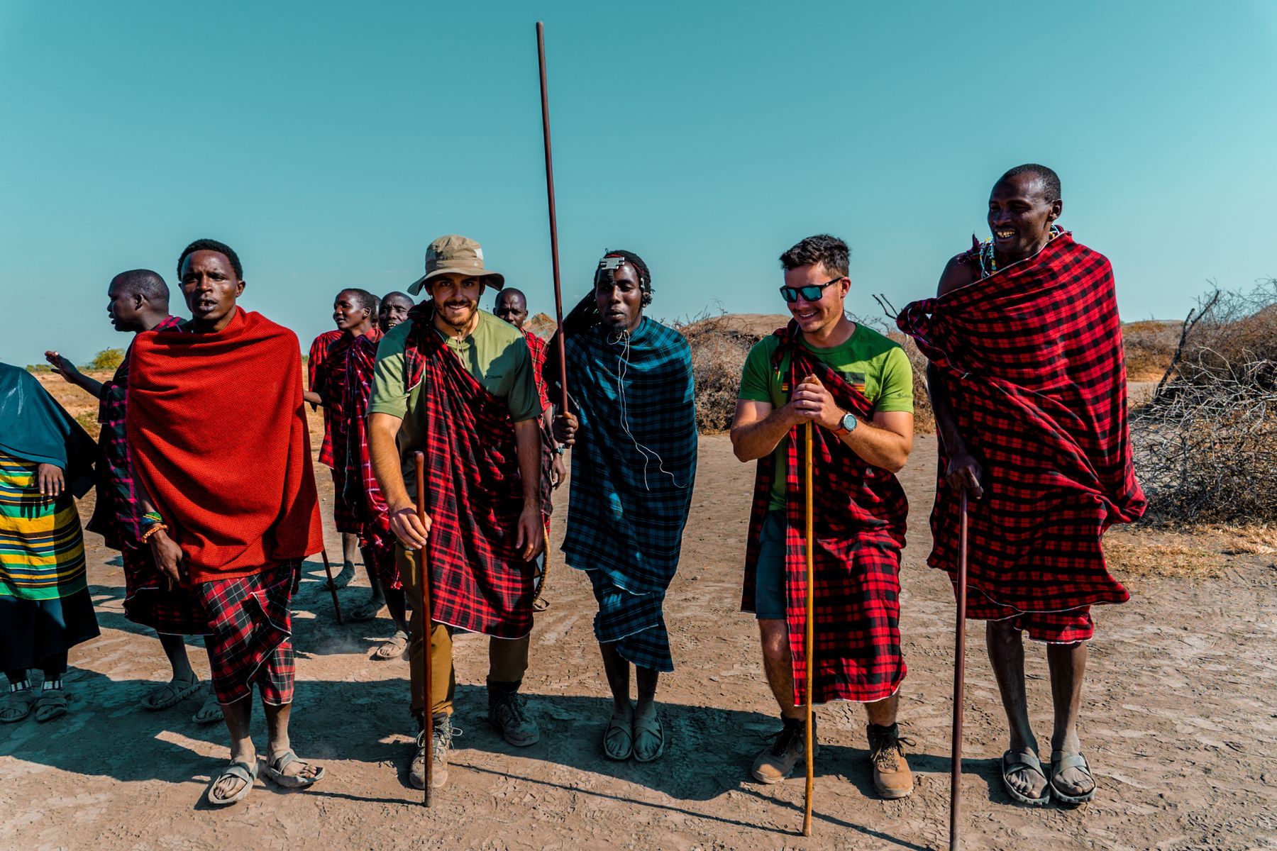 Travellers and Maasai hosts outdoors in Arusha